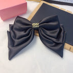 Satin Logo Bow Hair Clip — Elegant & Versatile